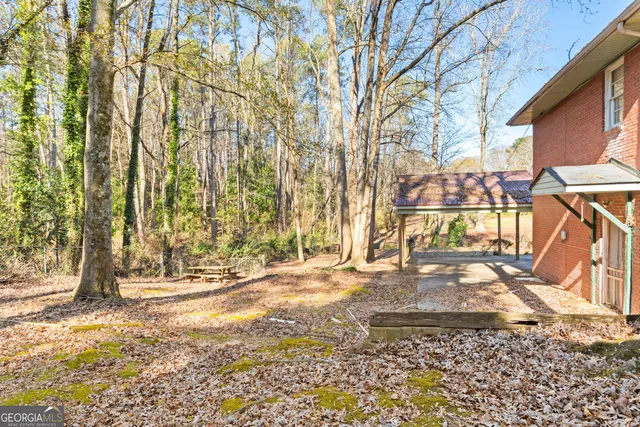 a kitchen with stainless steel appliances granite countertop a stove and a refrigerator