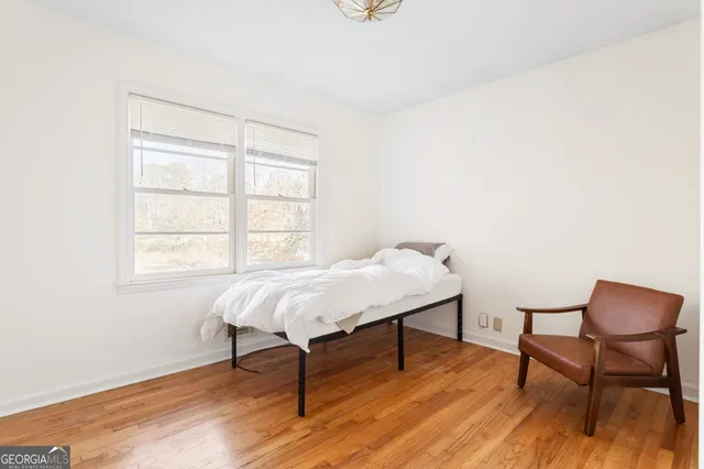 a kitchen with granite countertop a stove a sink and a refrigerator