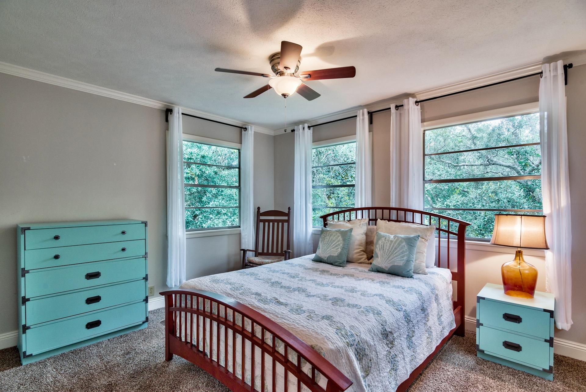 245 Baird Road Santa Rosa Beach, FL 32459 - Photo 22 of 44 a bedroom with a large bed and a window