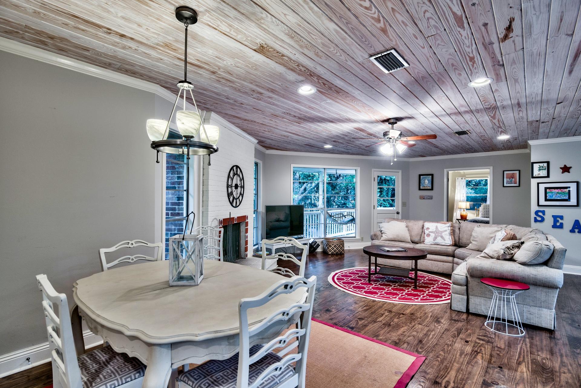 245 Baird Road Santa Rosa Beach, FL 32459 - Photo 44 of 44 a living room with furniture and a chandelier
