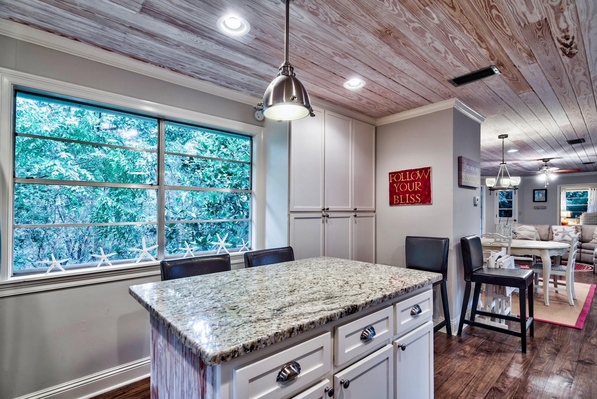 245 Baird Road Santa Rosa Beach, FL 32459 - Photo 8 of 44 a kitchen with kitchen island a large window in it
