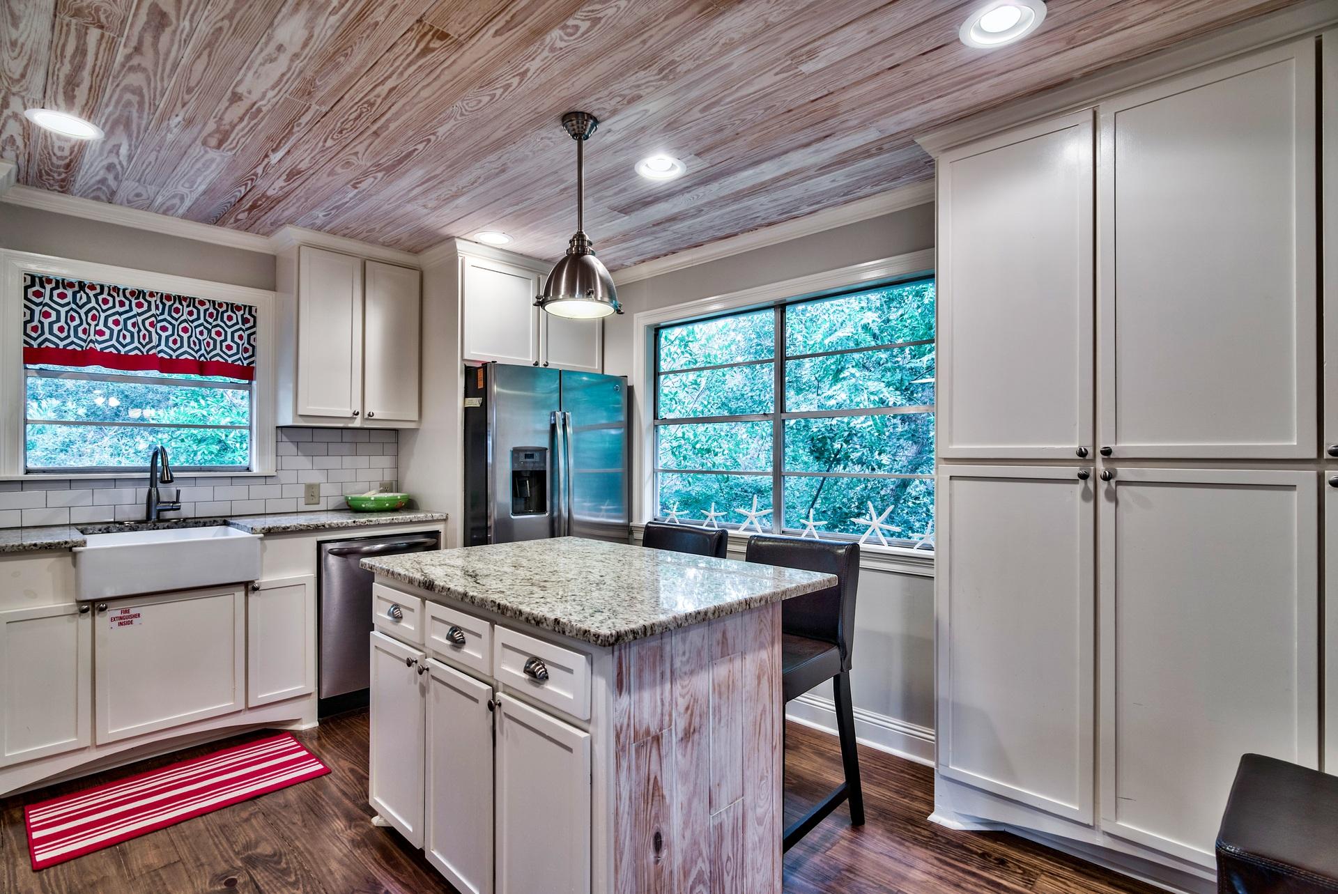 245 Baird Road Santa Rosa Beach, FL 32459 - Photo 9 of 44 a kitchen with a stove a sink and a refrigerator