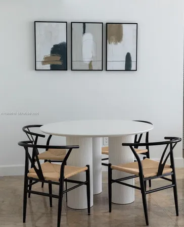 a view of a room that has a table and chair