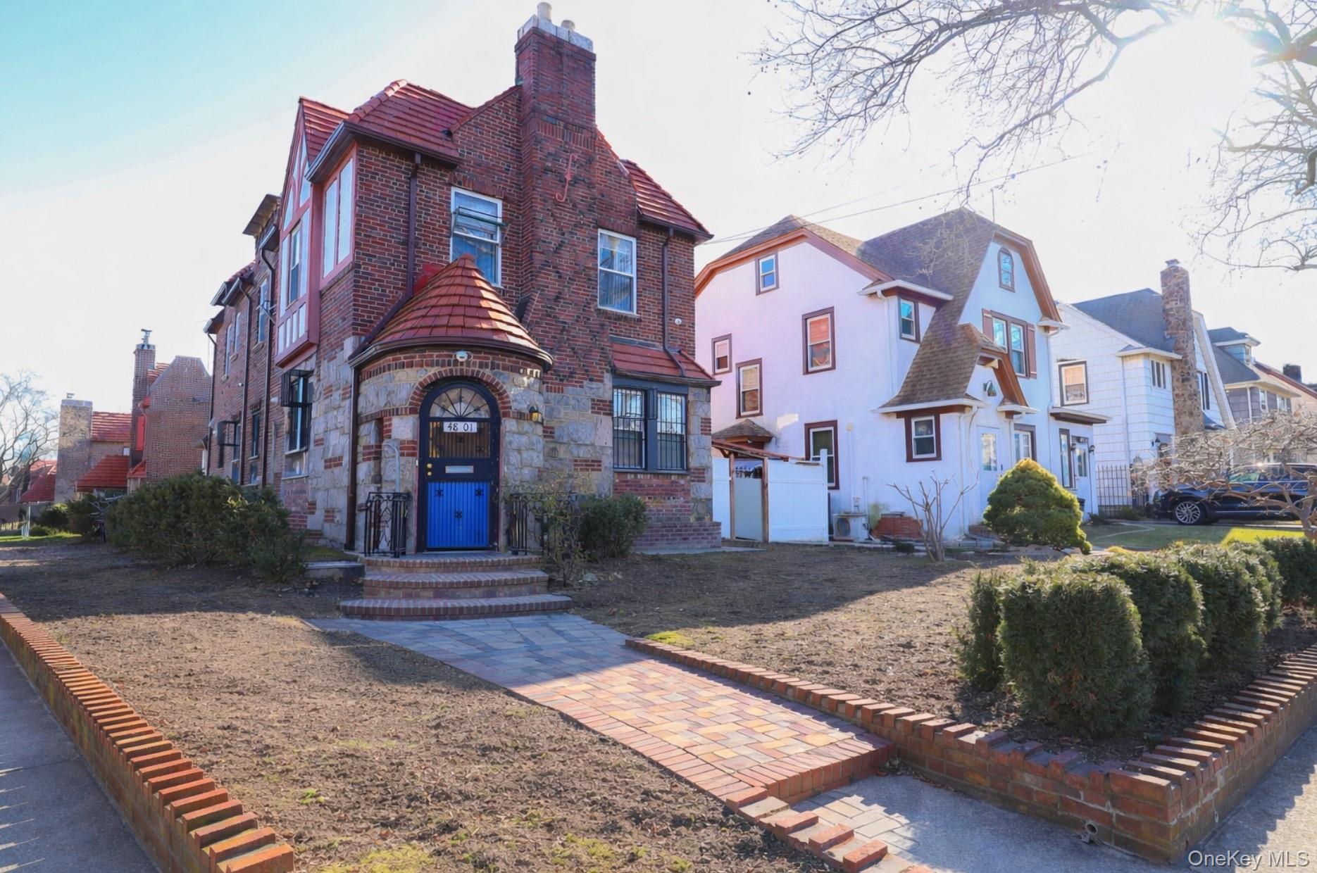 48-01 216th Street Queens, NY 11364 - Photo 2 of 14 a front view of a house with a yard