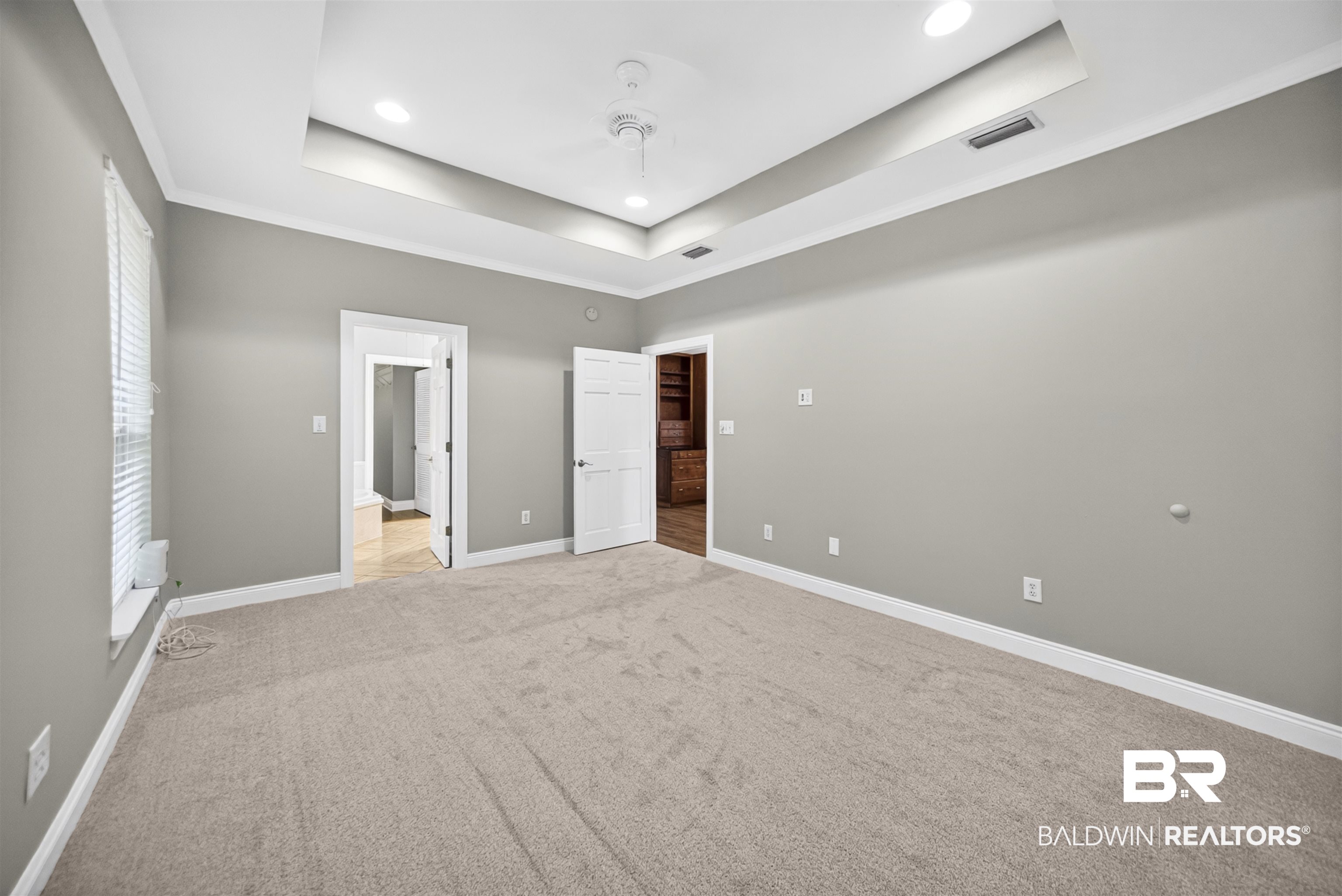 5913 Antoine Road Mobile, AL 36693 - Photo 11 of 33 Spacious room featuring neutral carpeting, light gray wall paint, and white trim