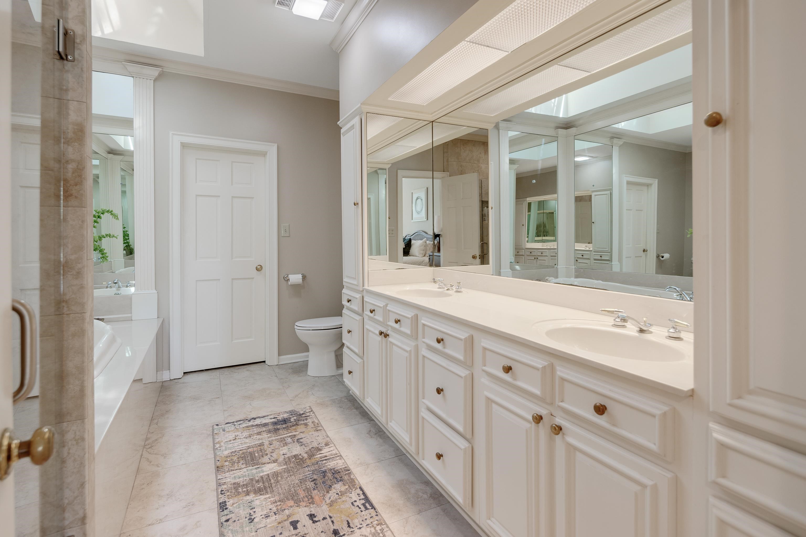 3345 Gallery Drive Memphis, TN 38125 - Photo 18 of 25 a spacious bathroom with double vanity sink a mirror and a shower