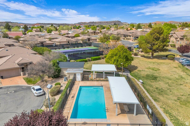 345 North 2450th Street East, Unit 152 St. George, UT 84790 - Photo 38 of 40 Aerial view of residential area featuring a pool and a mountain backdrop