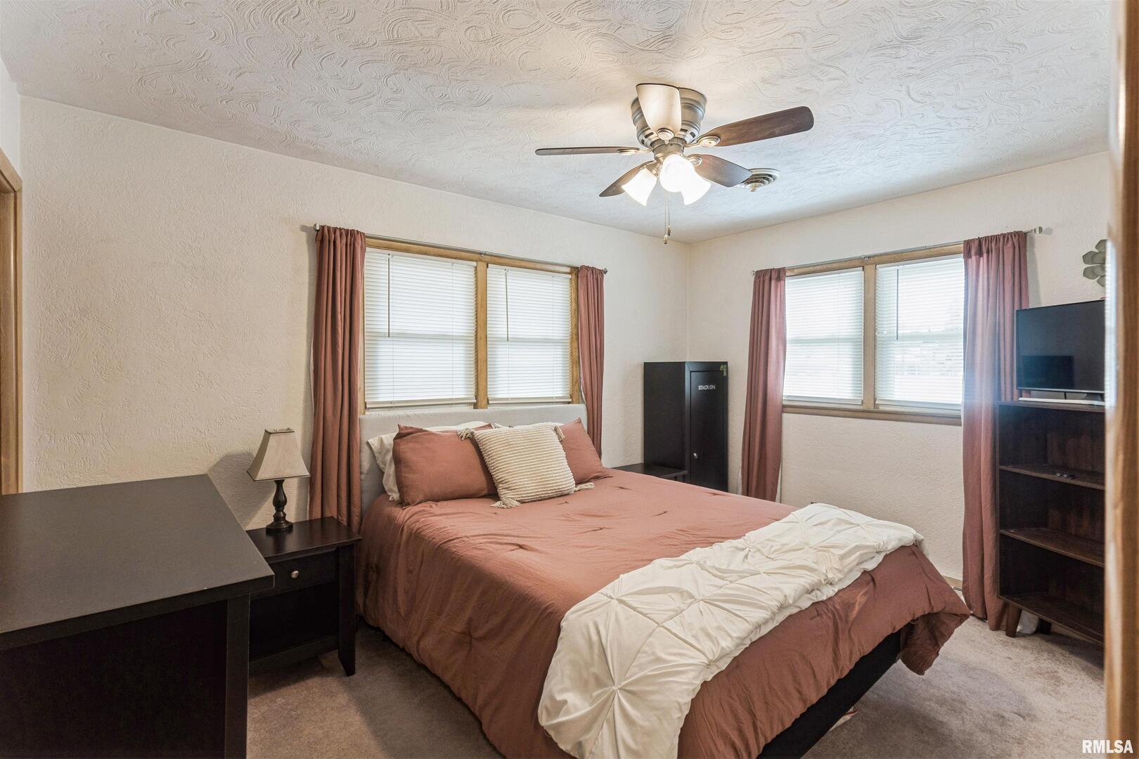 208 North Depot Street Annawan, IL 61234 - Photo 15 of 25 a bedroom with a large bed and a window