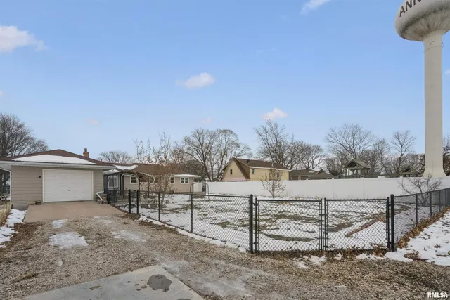 a view of a house with a snow in the yard