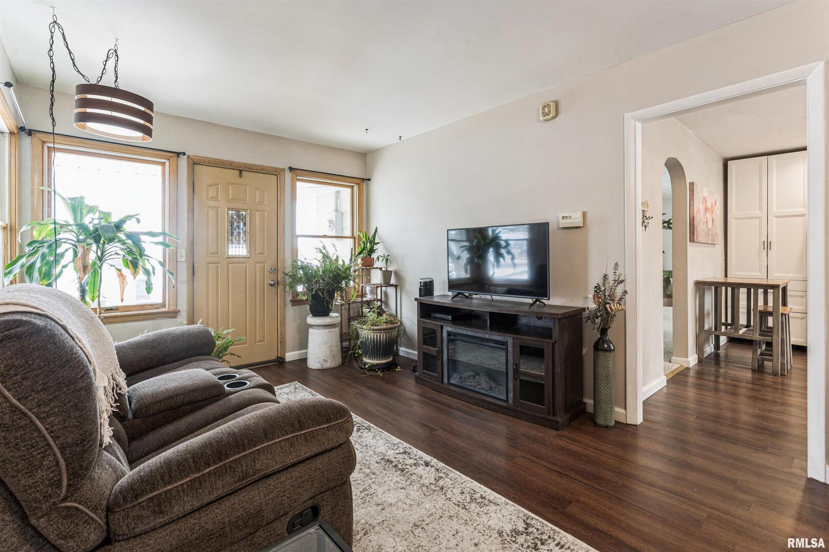 208 North Depot Street Annawan, IL 61234 - Photo 8 of 25 a living room with furniture and a flat screen tv