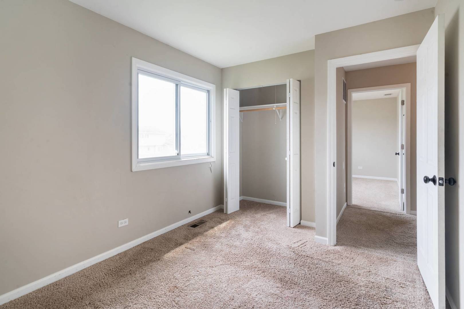 50 Willow Road Matteson, IL 60443 - Photo 11 of 21 a view of an empty room with closet and a window