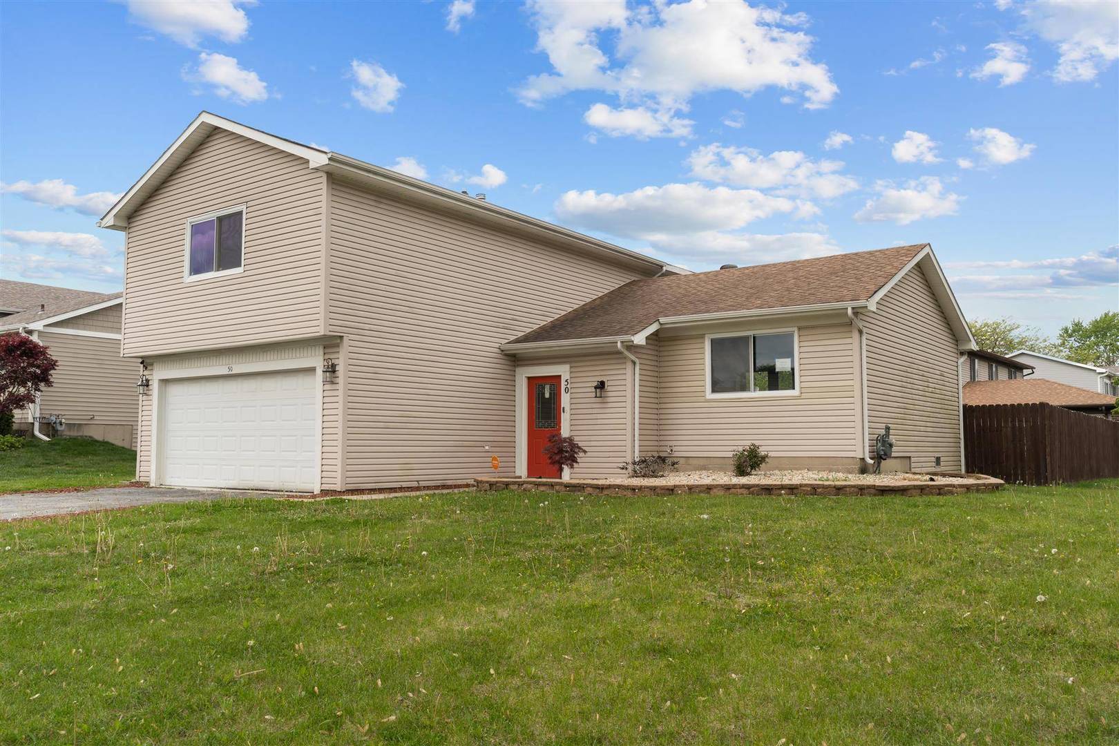 50 Willow Road Matteson, IL 60443 - Photo 2 of 21 a front view of house with yard and trees in the background