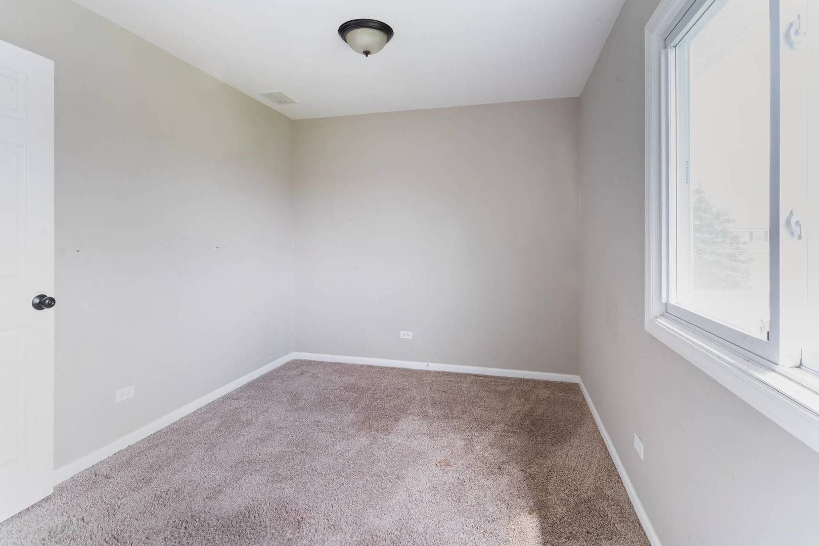 50 Willow Road Matteson, IL 60443 - Photo 10 of 21 an empty room with a window