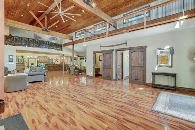 a living room with fireplace furniture and a flat screen tv