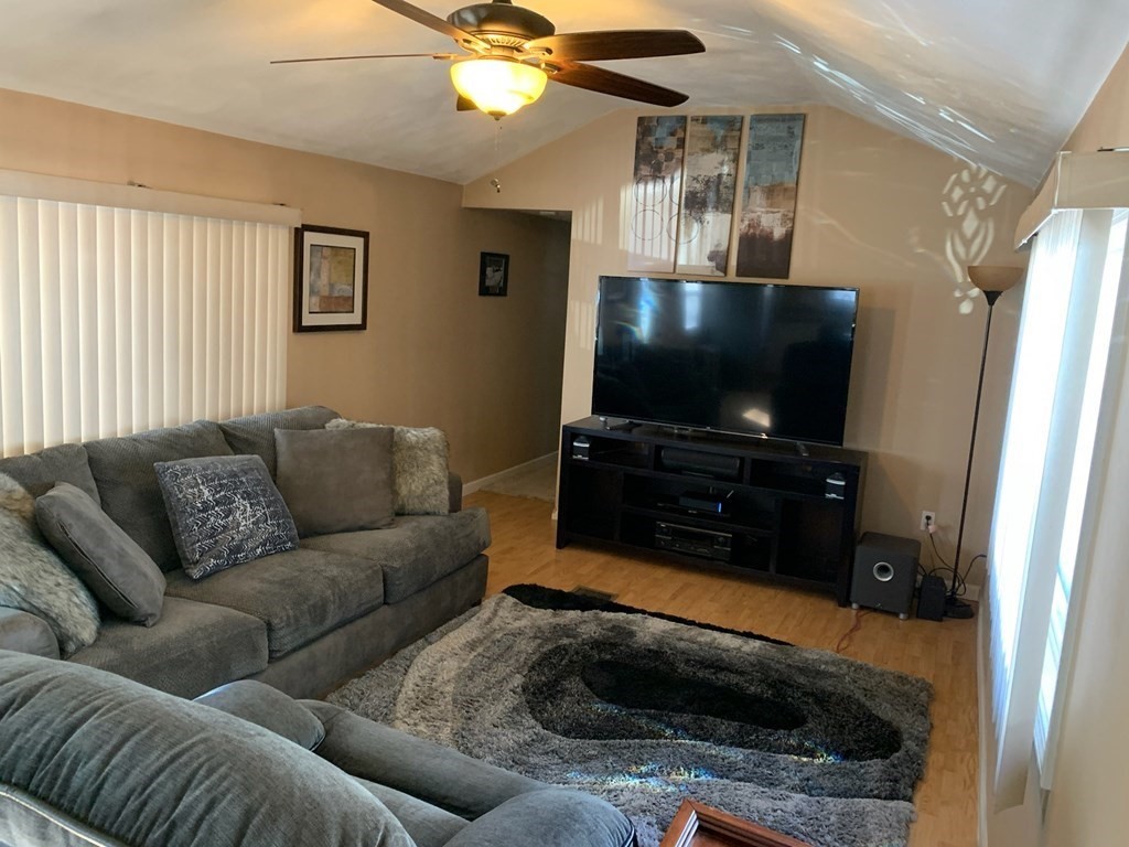 846 Broadway, Unit 45 Saugus, MA 01906 - Photo 5 of 11 a living room with furniture and a flat screen tv