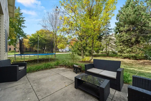 a view of a garden with sitting area