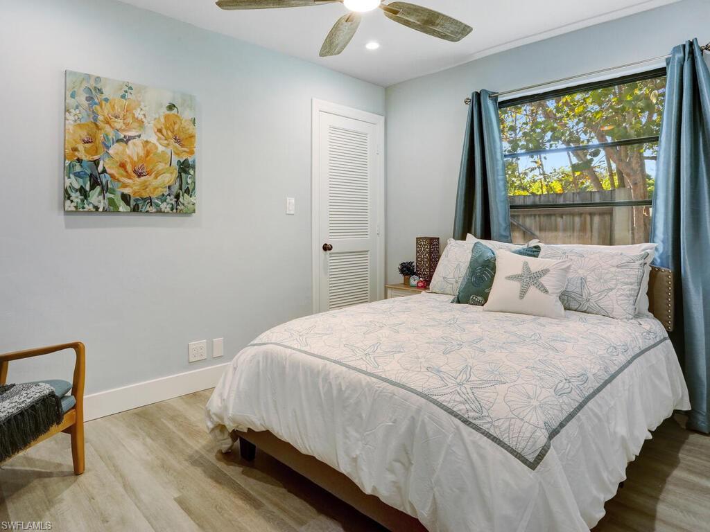 1014 Broad Avenue North Naples, FL 34102 - Photo 22 of 33 a bedroom with a bed and a window