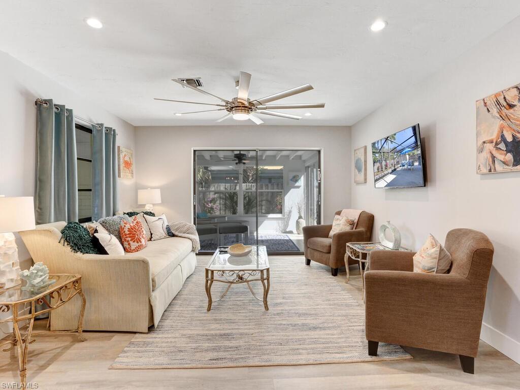1014 Broad Avenue North Naples, FL 34102 - Photo 6 of 33 a living room with furniture and a large window