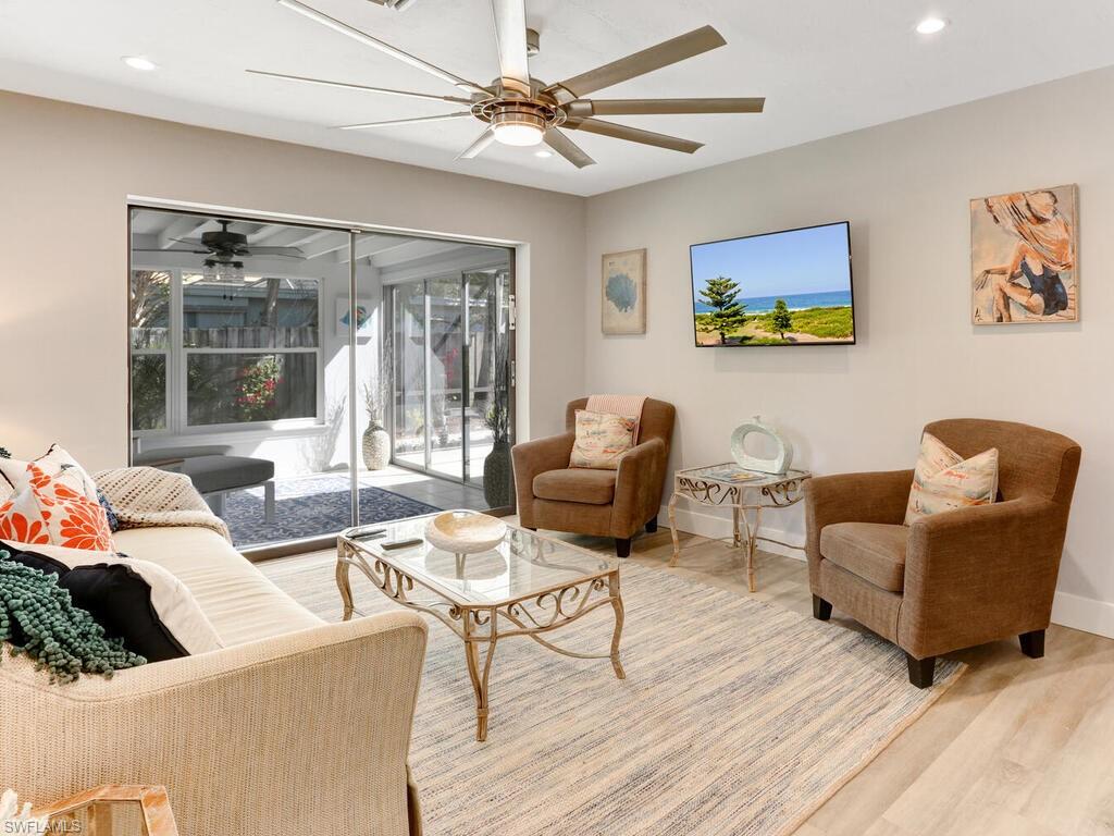 1014 Broad Avenue North Naples, FL 34102 - Photo 8 of 33 a living room with furniture and a large window