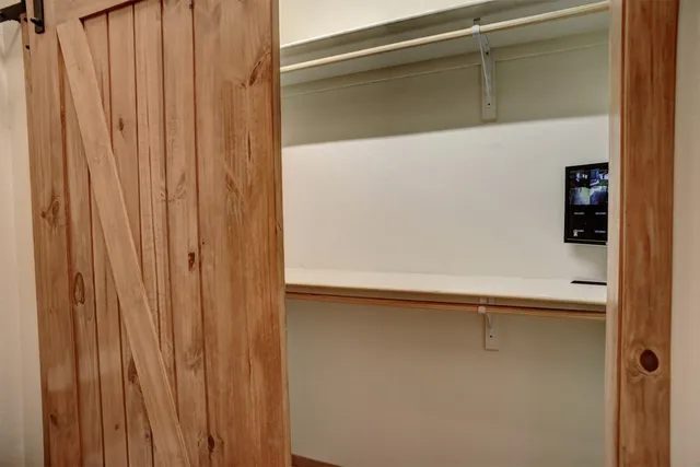 a bathroom with a window and a shower