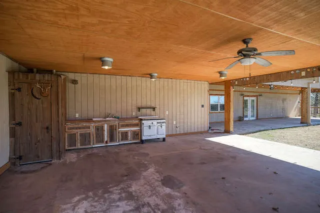 a view of a livingroom with a furniture and ceiling fan