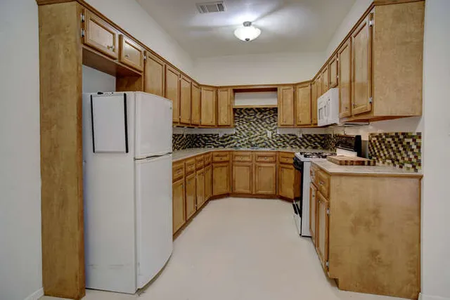 a bathroom with a sink a mirror and a shower
