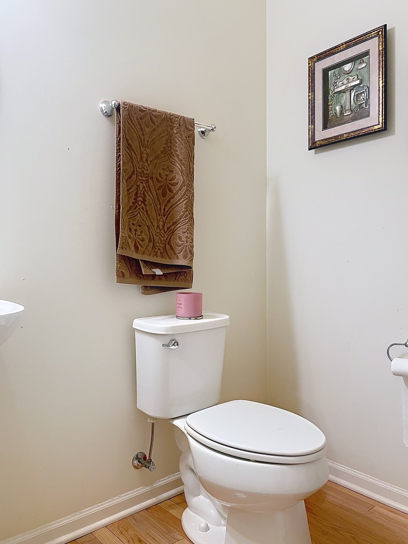 2018 Shermer Road, Unit 2018 Glenview, IL 60026 - Photo 14 of 39 a white toilet sitting next to a small bathroom