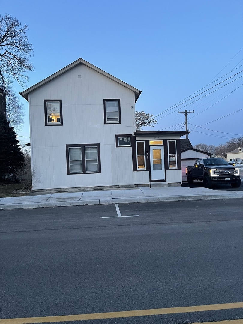 5420 West Main Street Monee, IL 60449 - Photo 1 of 16 a car parked in front of a house