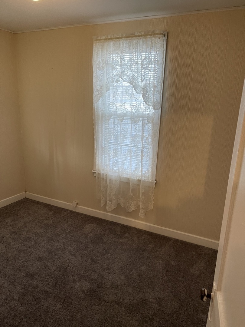 5420 West Main Street Monee, IL 60449 - Photo 12 of 16 an empty room with a window