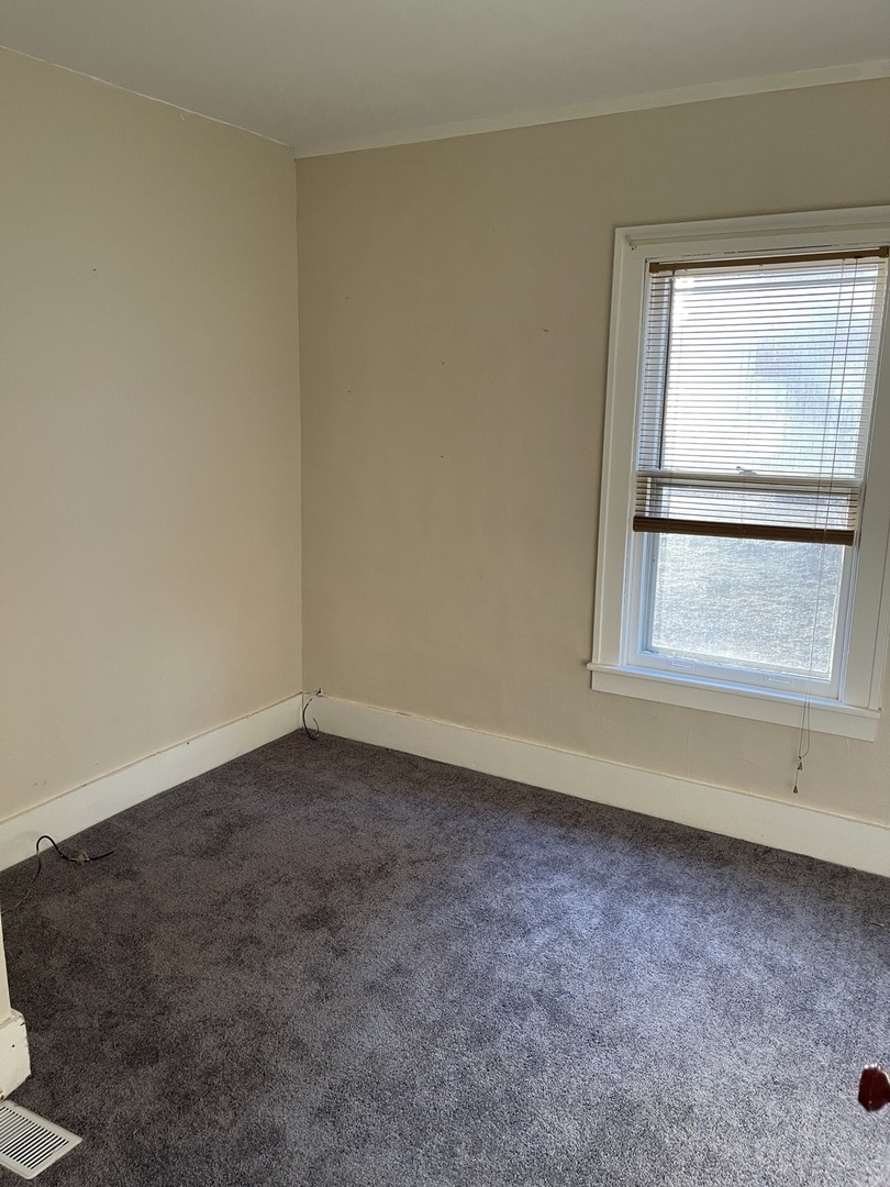5420 West Main Street Monee, IL 60449 - Photo 14 of 16 a view of an empty room with a window