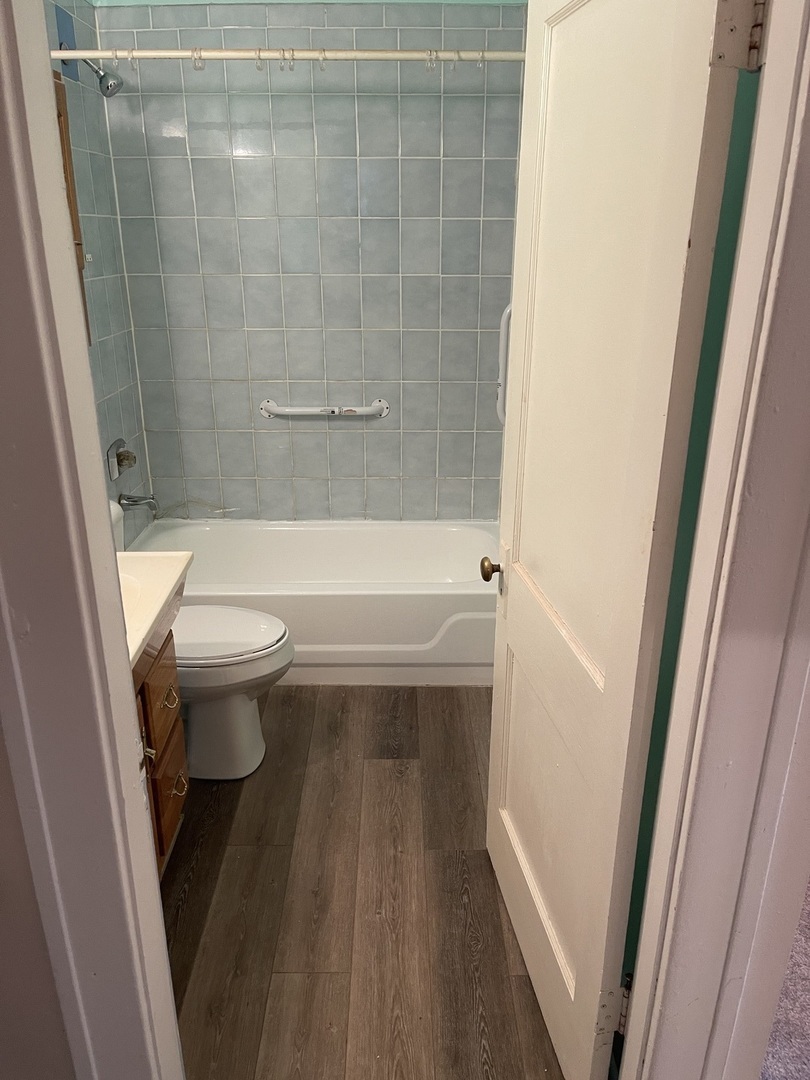 5420 West Main Street Monee, IL 60449 - Photo 15 of 16 a bathroom with a sink a toilet and shower