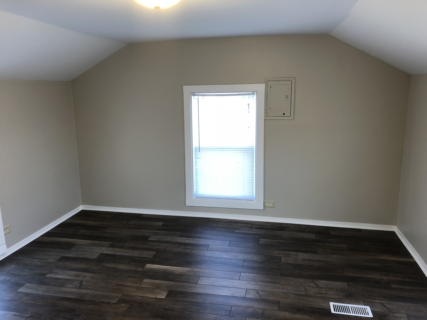 5420 West Main Street Monee, IL 60449 - Photo 2 of 16 a view of an empty room with wooden floor and a window