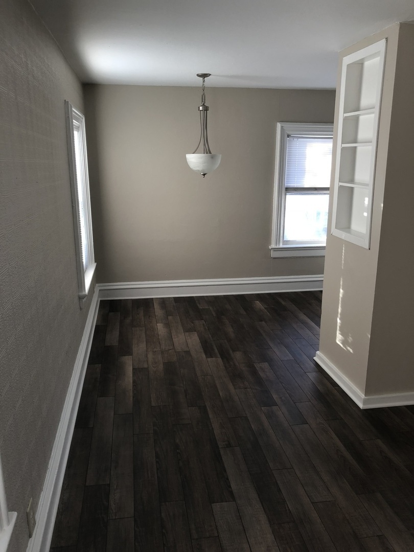 5420 West Main Street Monee, IL 60449 - Photo 8 of 16 wooden floor in an empty room with a window