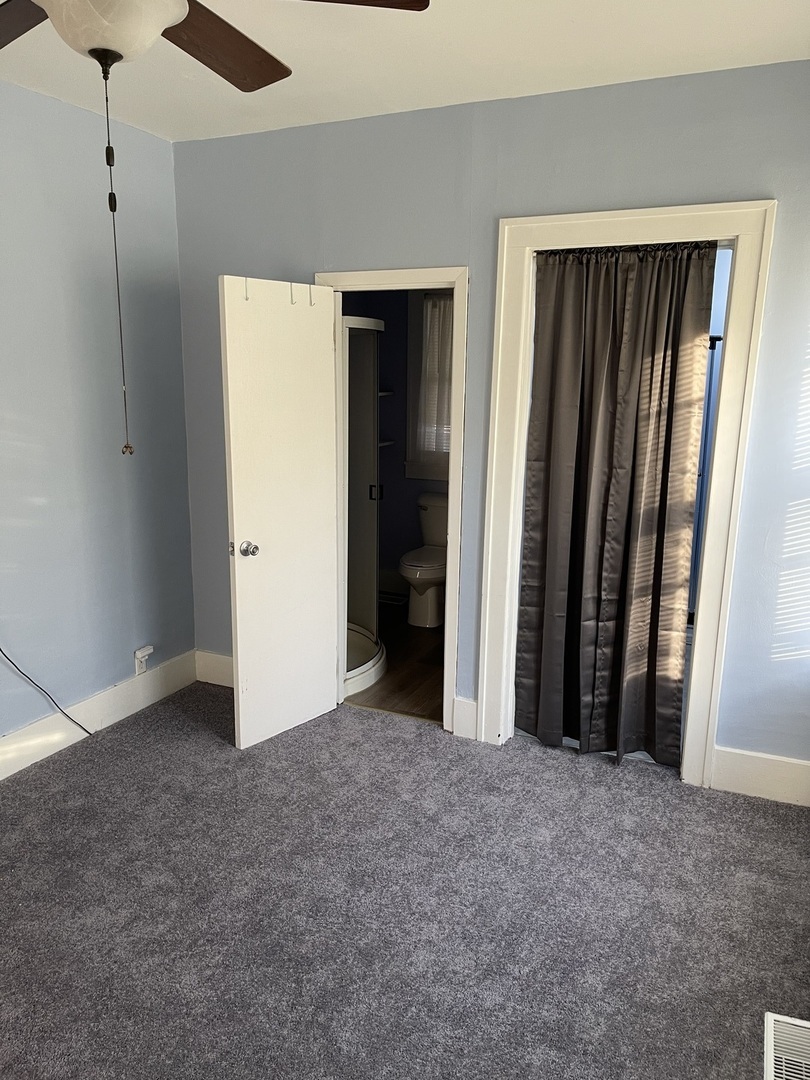 5420 West Main Street Monee, IL 60449 - Photo 9 of 16 an empty room with windows and closet