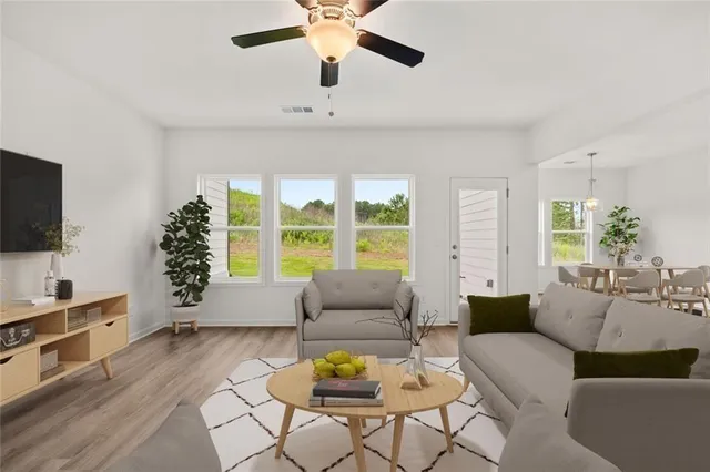 a large kitchen with stainless steel appliances sink microwave and cabinets