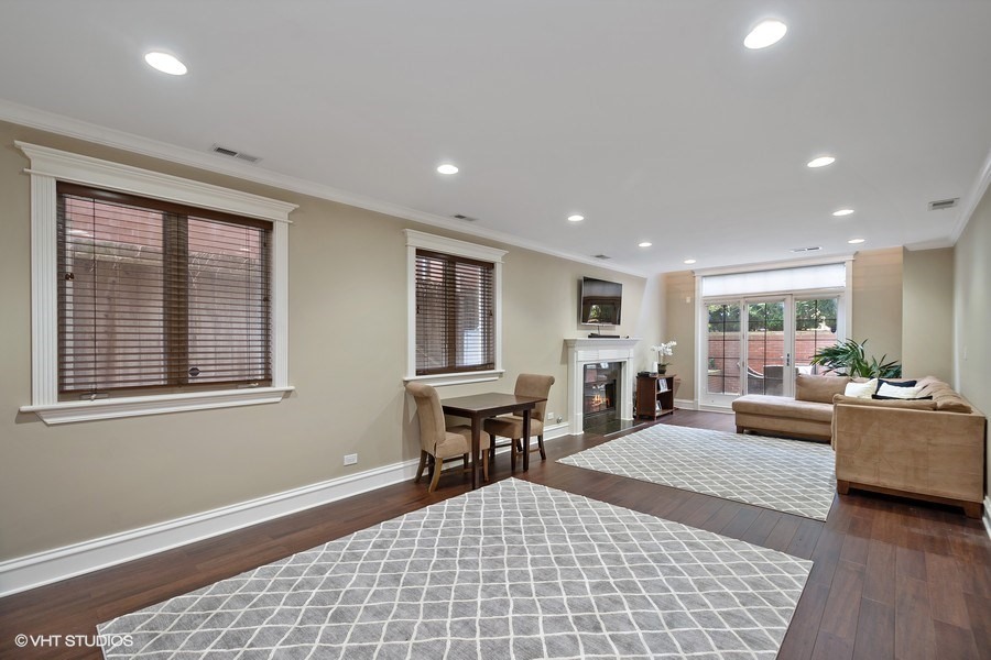 1365 North Mohawk Street, Unit 1S Chicago, IL 60610 - Photo 12 of 15 a living room with furniture and a window