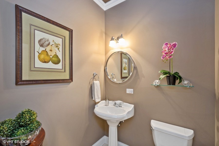 1365 North Mohawk Street, Unit 1S Chicago, IL 60610 - Photo 13 of 15 a bathroom with a sink mirror and vanity