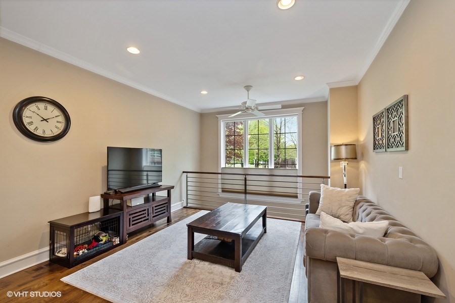 1365 North Mohawk Street, Unit 1S Chicago, IL 60610 - Photo 5 of 15 a living room with furniture a flat screen tv and a window
