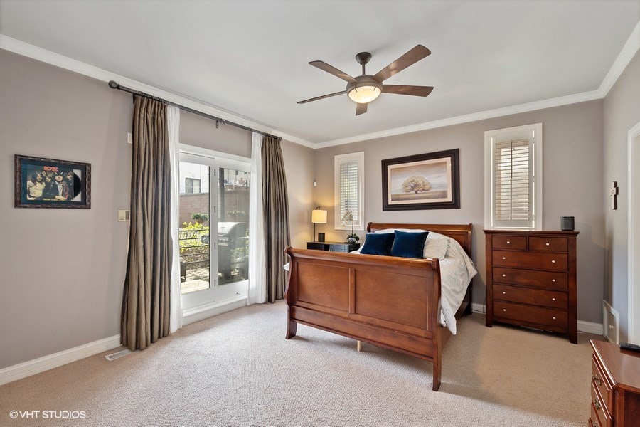 1365 North Mohawk Street, Unit 1S Chicago, IL 60610 - Photo 7 of 15 a bed room with a bed and a chandelier