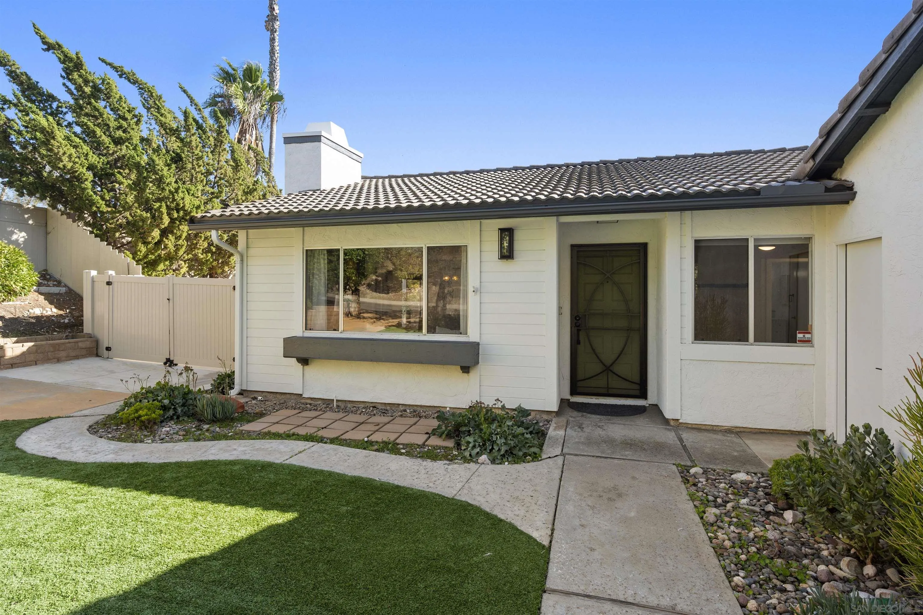2321 Farrington Drive El Cajon, CA 92020 - Photo 11 of 47 a front view of a house with a garden