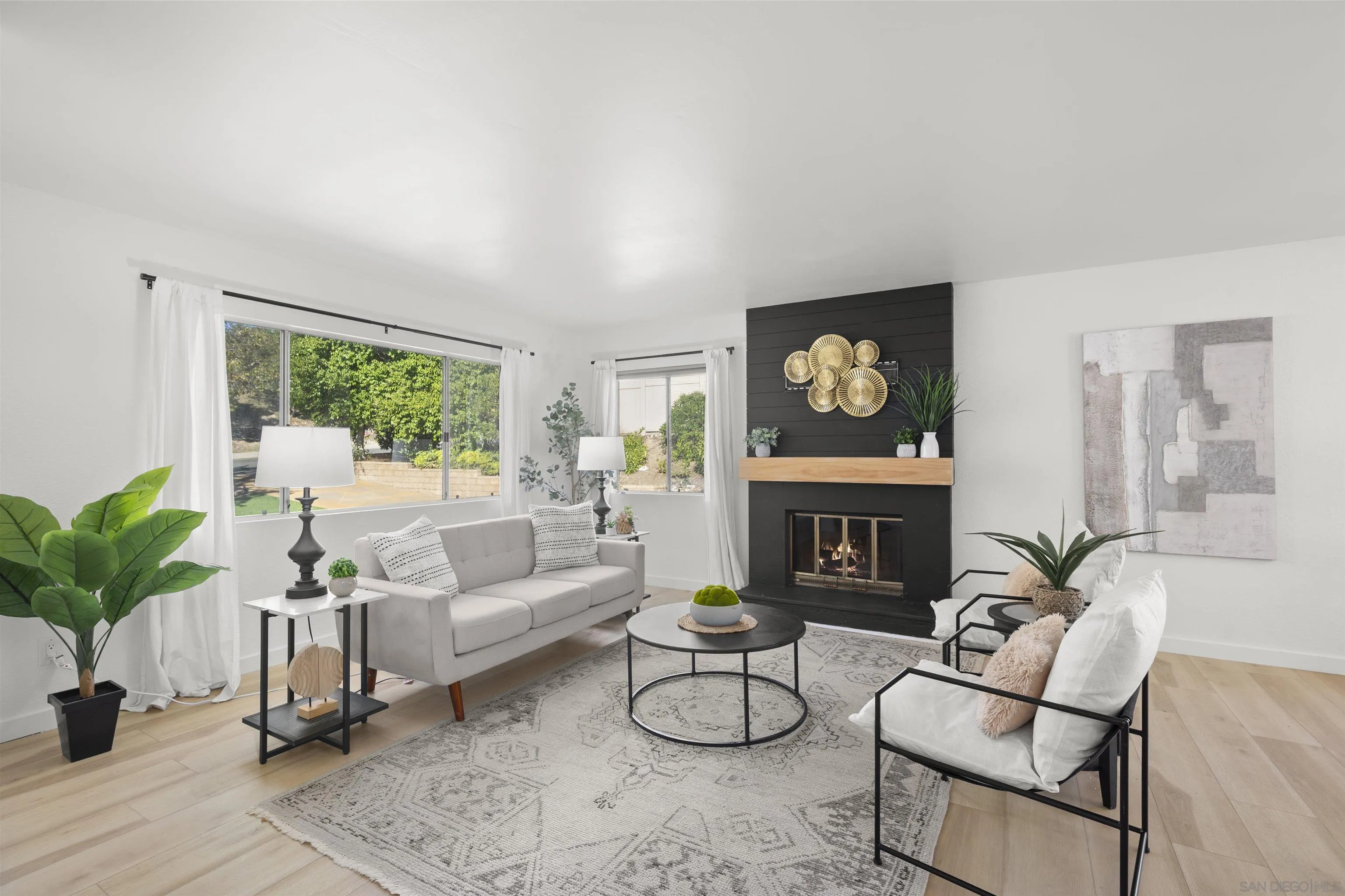 2321 Farrington Drive El Cajon, CA 92020 - Photo 14 of 47 a living room with furniture a fireplace and potted plants