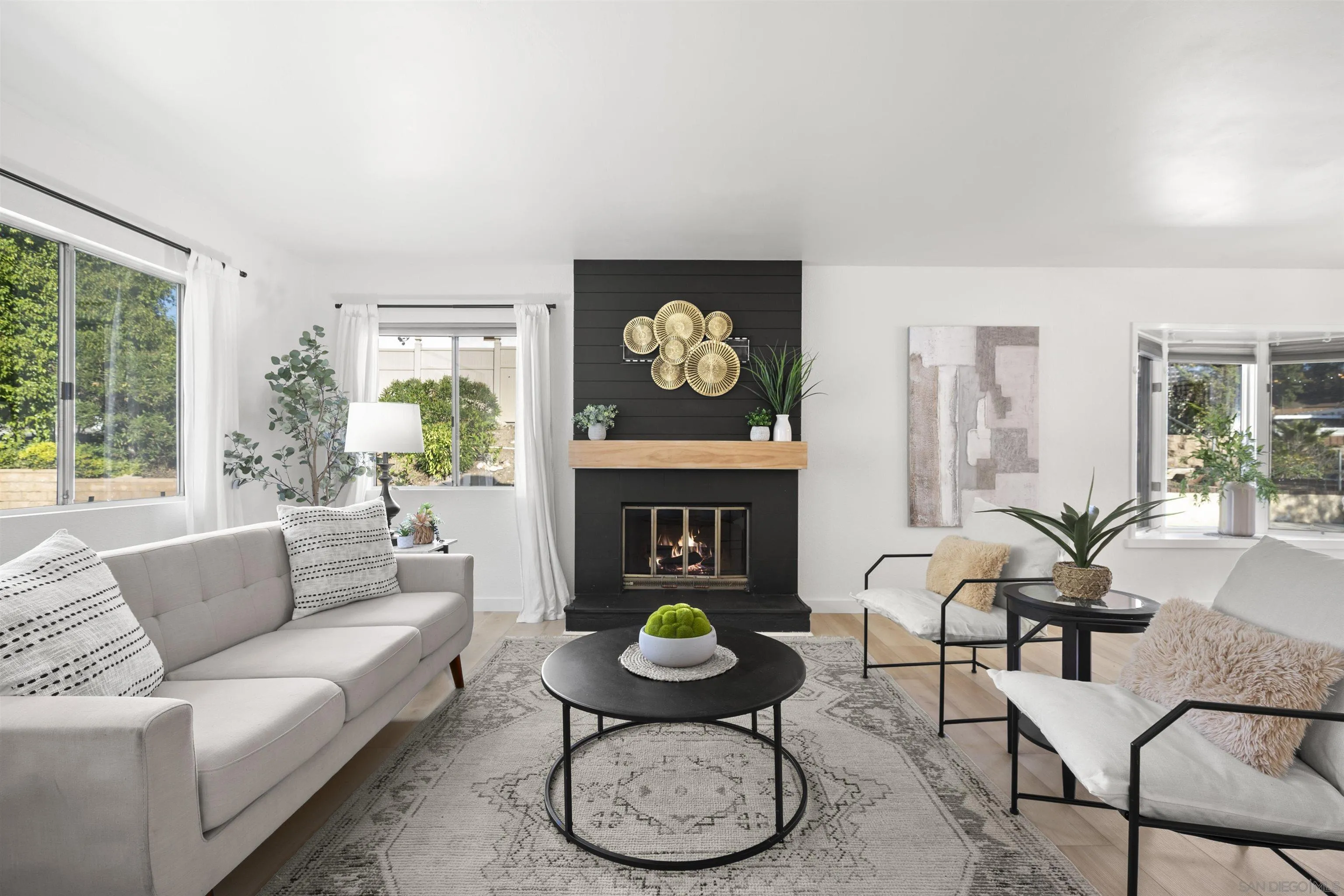 2321 Farrington Drive El Cajon, CA 92020 - Photo 15 of 47 a living room with furniture a fireplace with table and chairs