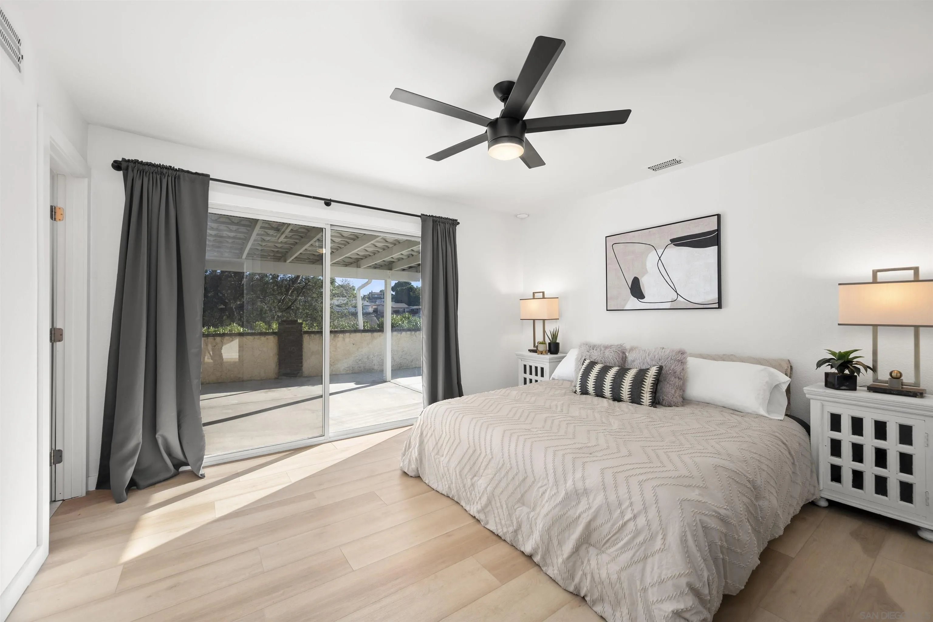 2321 Farrington Drive El Cajon, CA 92020 - Photo 28 of 47 a bedroom with a large bed and a window