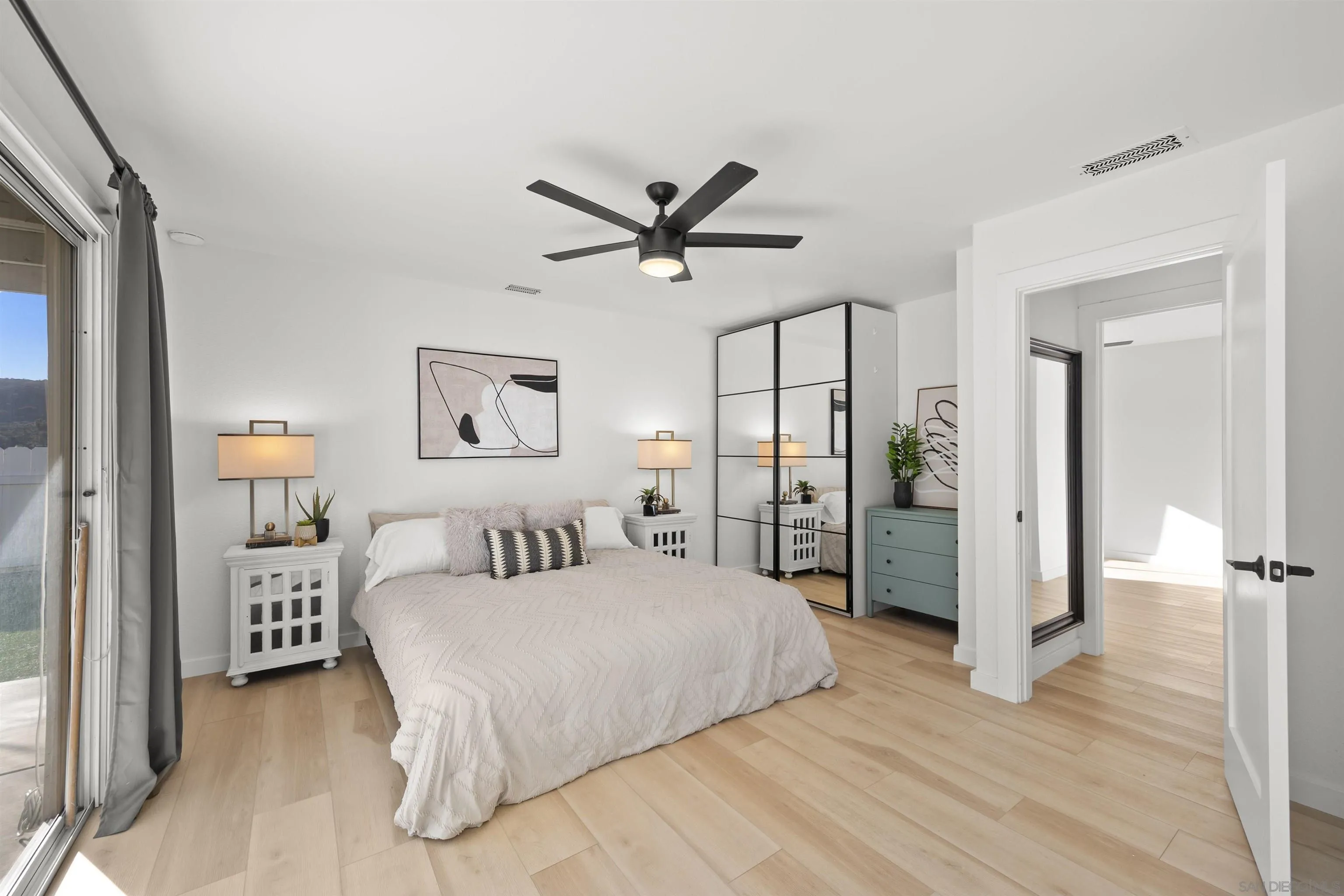 2321 Farrington Drive El Cajon, CA 92020 - Photo 29 of 47 a bedroom with a bed and a chandelier