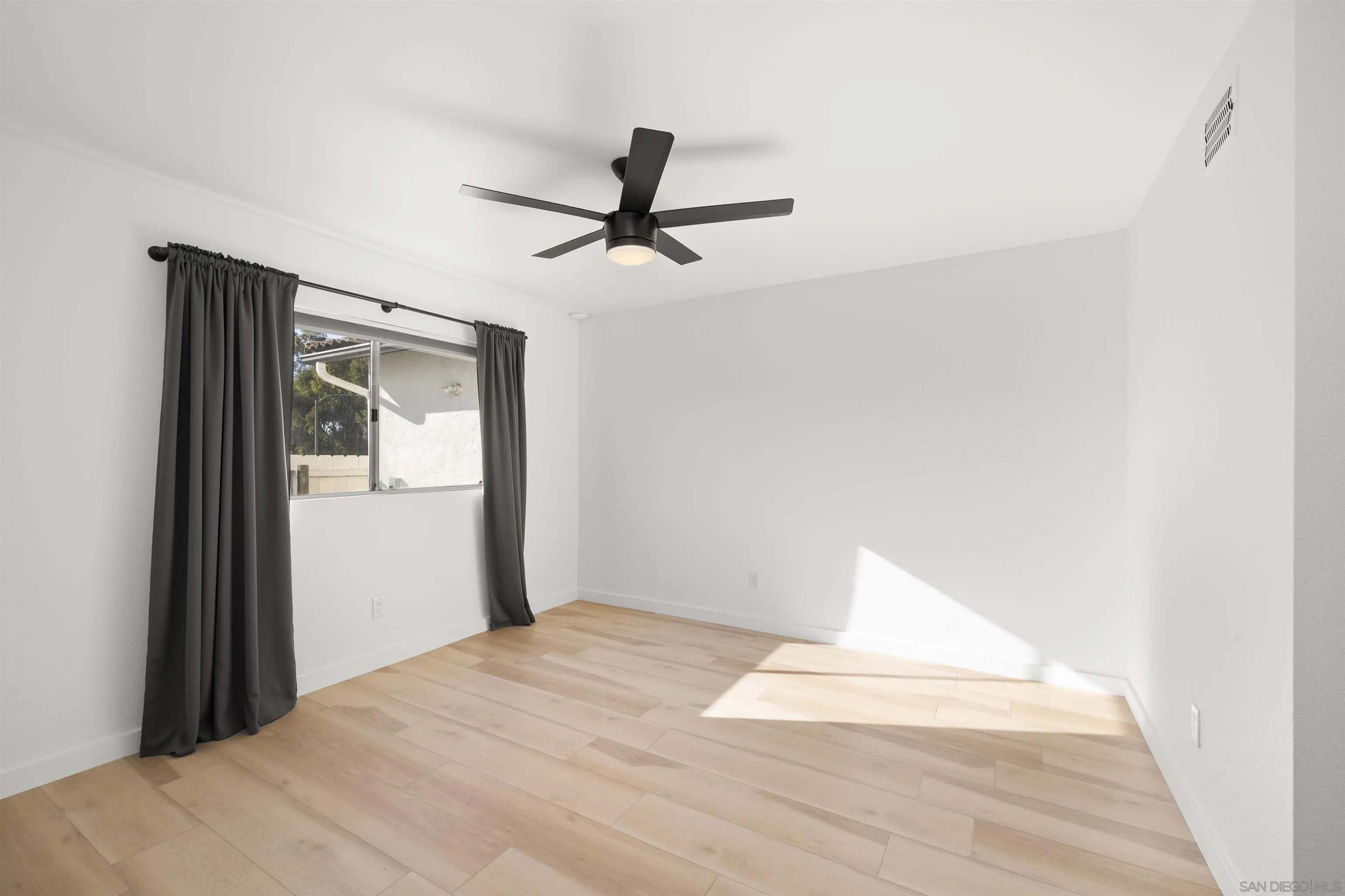 2321 Farrington Drive El Cajon, CA 92020 - Photo 31 of 47 a bedroom with a bed and a window