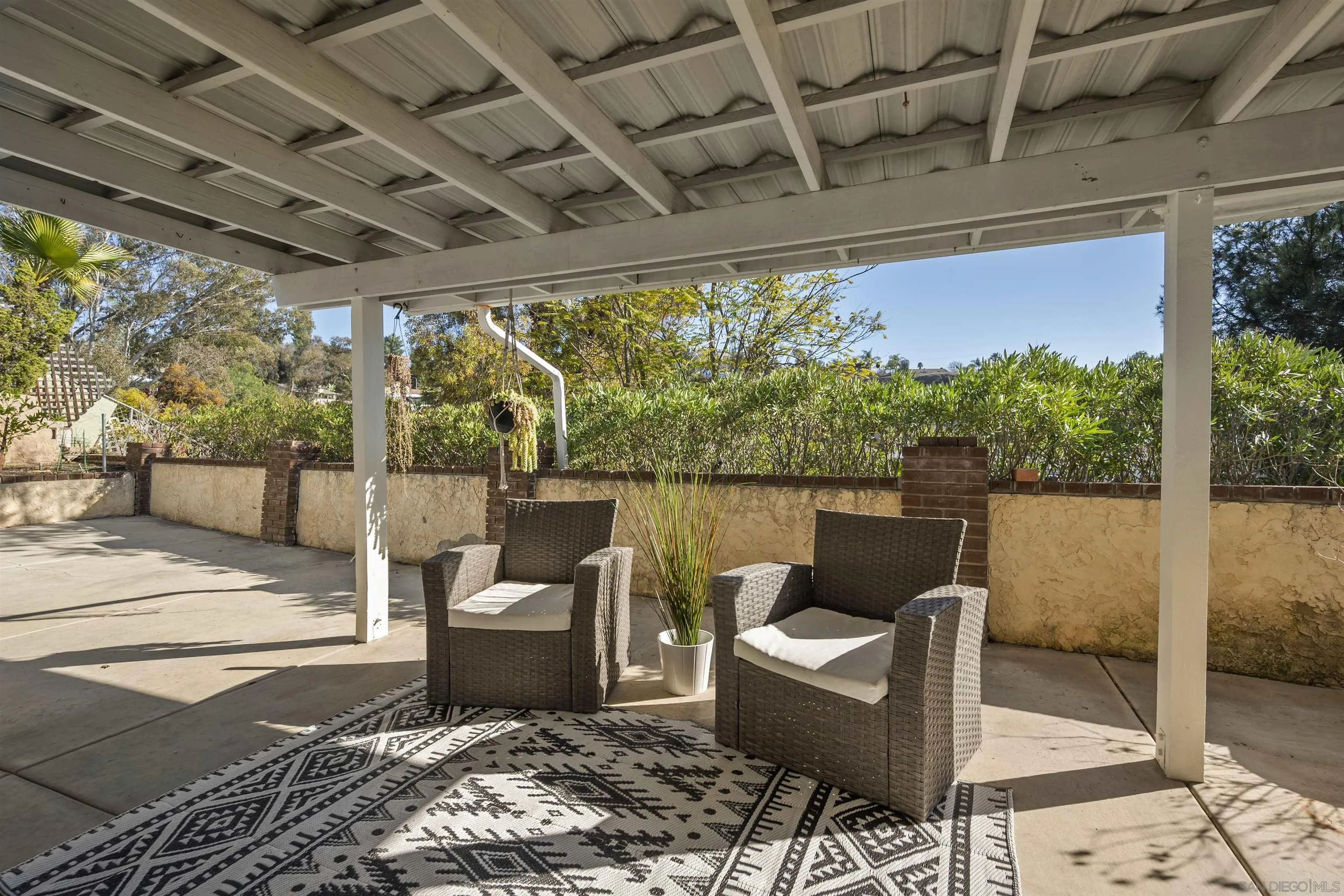 2321 Farrington Drive El Cajon, CA 92020 - Photo 37 of 47 a view of a patio with couches chairs and wooden floor