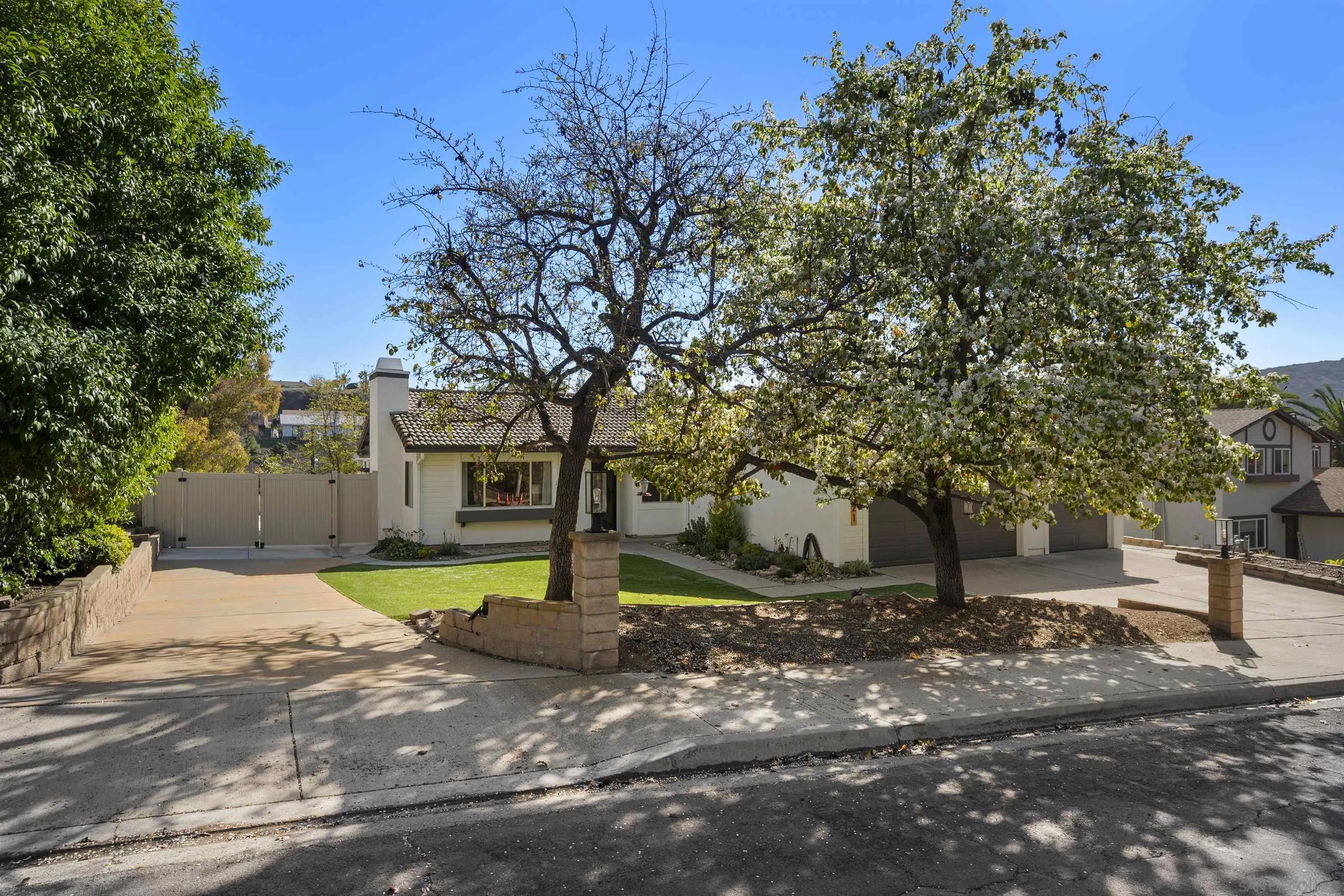 2321 Farrington Drive El Cajon, CA 92020 - Photo 7 of 47 a tree in the middle of a yard