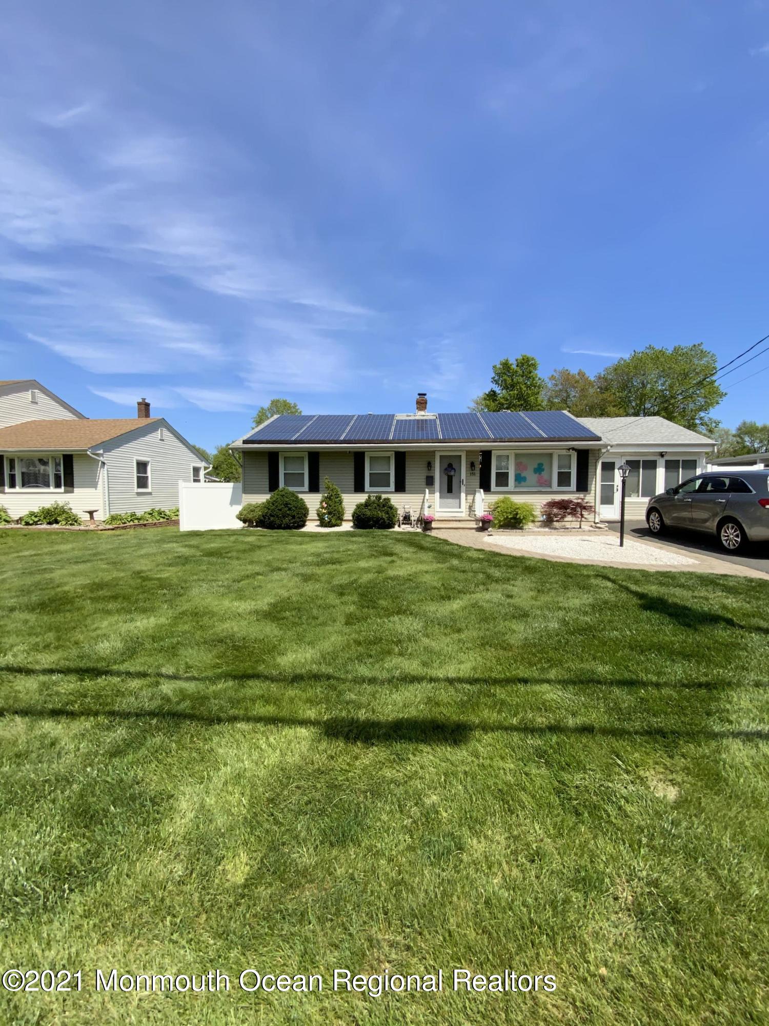 151 Ravine Drive Matawan, NJ 07747 - Photo 1 of 23 a view of house with a yard