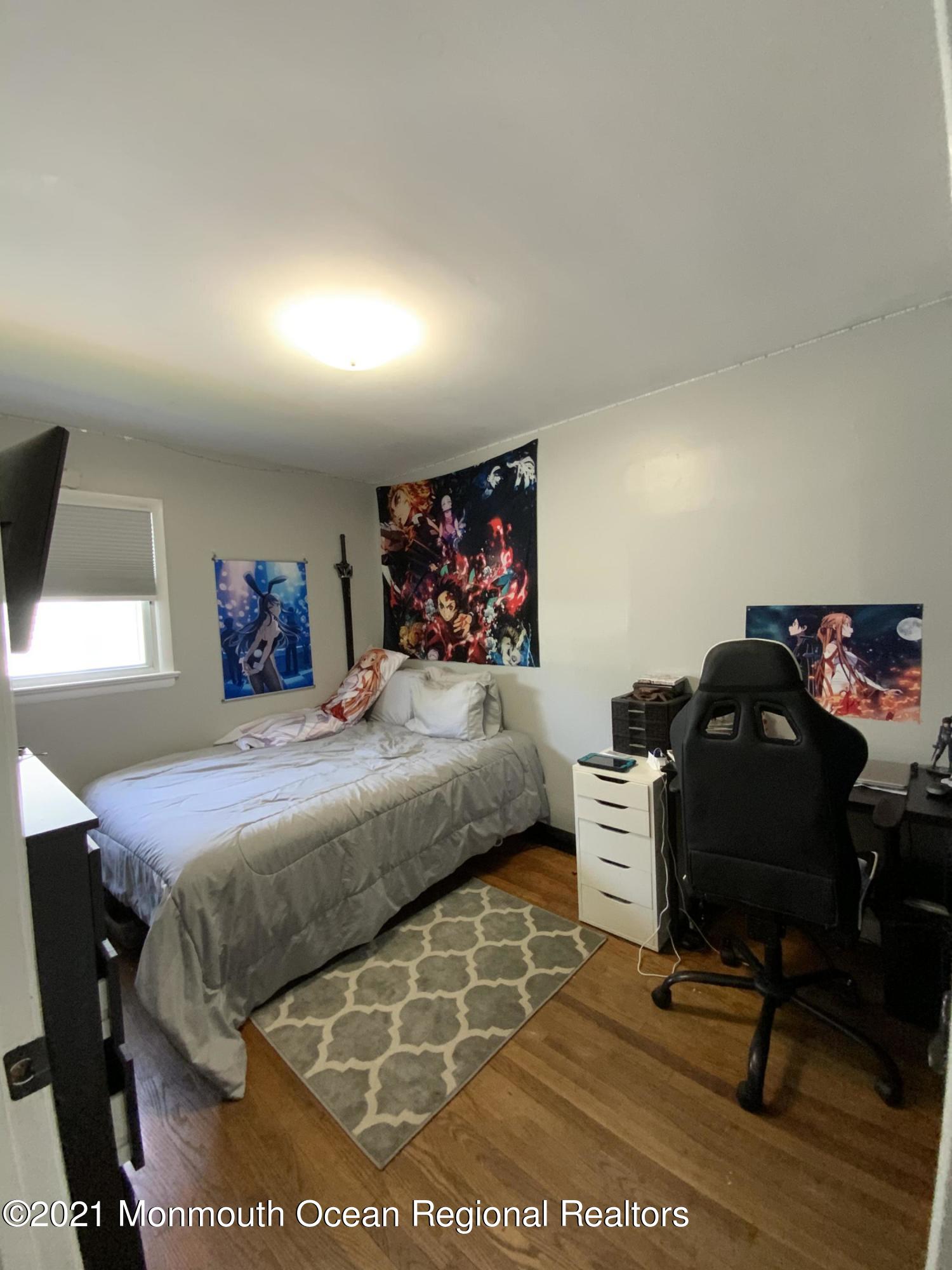 151 Ravine Drive Matawan, NJ 07747 - Photo 11 of 23 a bedroom with a bed and a desk