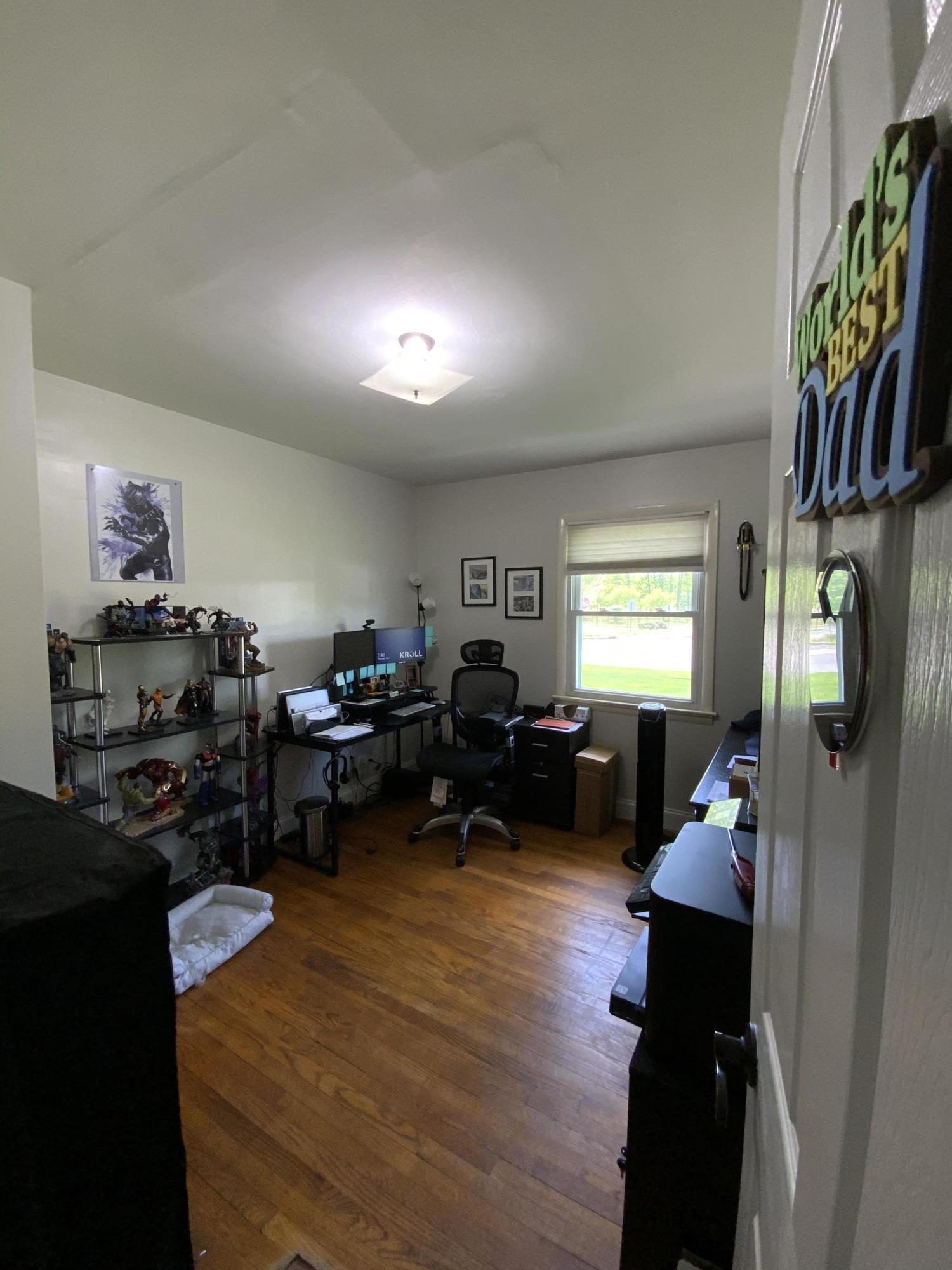 151 Ravine Drive Matawan, NJ 07747 - Photo 12 of 23 a living room with furniture a bookshelf and a window